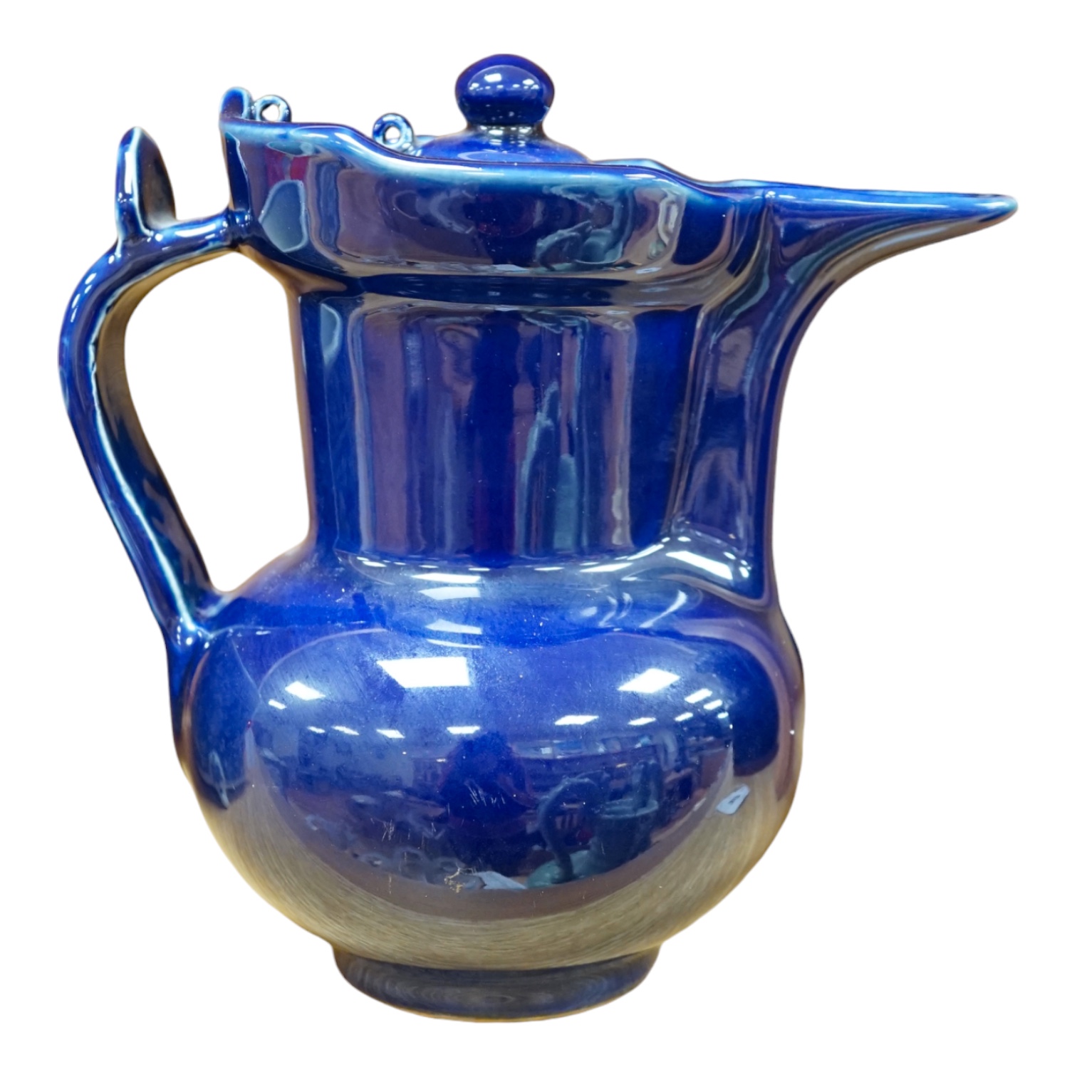 A Chinese dark blue glazed ewer and cover, 23cm high. Condition - good